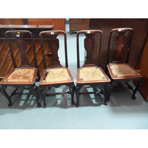 135 - Four inlaid rush seated dining chairs