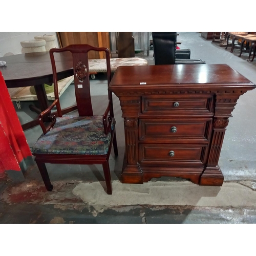 147 - A mahogany armchair and a mahogany cupboard