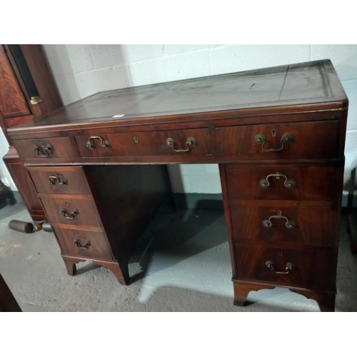 155 - A twin pedestal desk with leatherette insert