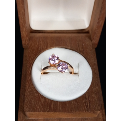 204 - A 14k gold (hallmarked) ladies dress ring with two large pink stones