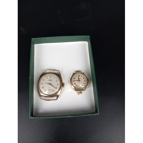 205 - A gents and a ladies 9k gold watches weight including movements and glass etc 24.6grams