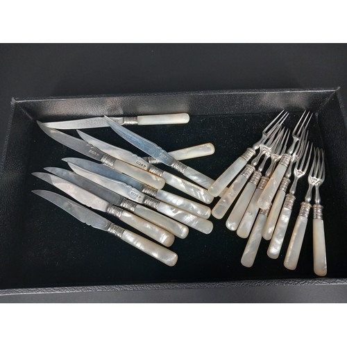 222 - A set of ten hallmarked silver (Walker and Hall) and mother of pearl handled fruit knives and forks ... 