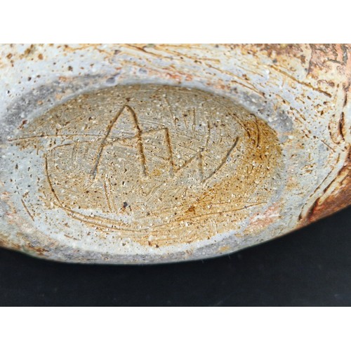 241 - An Alan Wallwork (1931-2019) studio pottery vase with incised vertical decoration in creams and brow... 