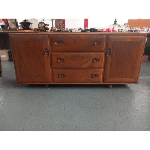 101 - An Ercol sideboard on casters