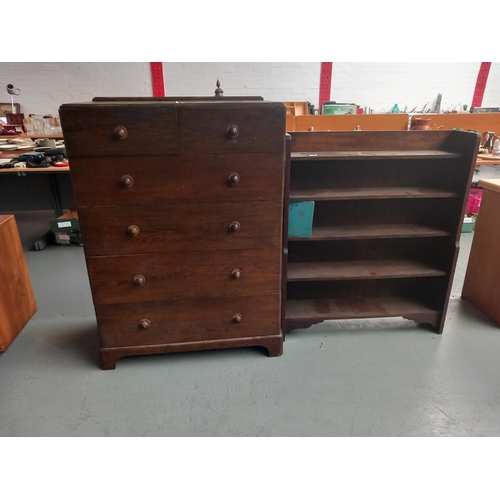 102 - An oak two over four chest of drawers and an oak bookcase