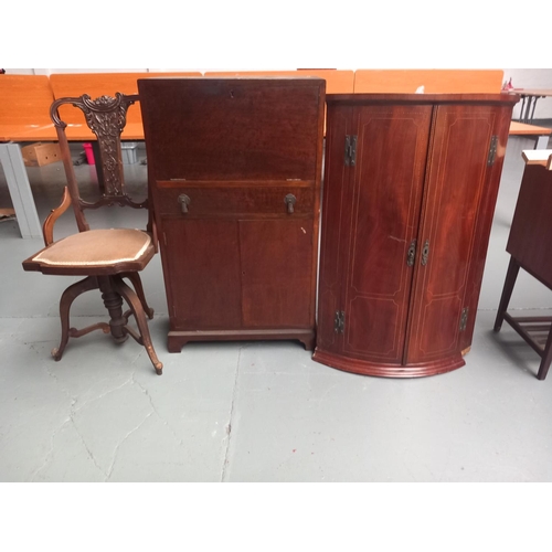 114 - A mahogany inlaid corner cabinet, drinks cabinet and a swivel chair