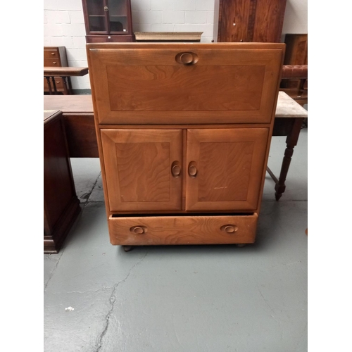 117 - An Ercol drinks cabinet on casters