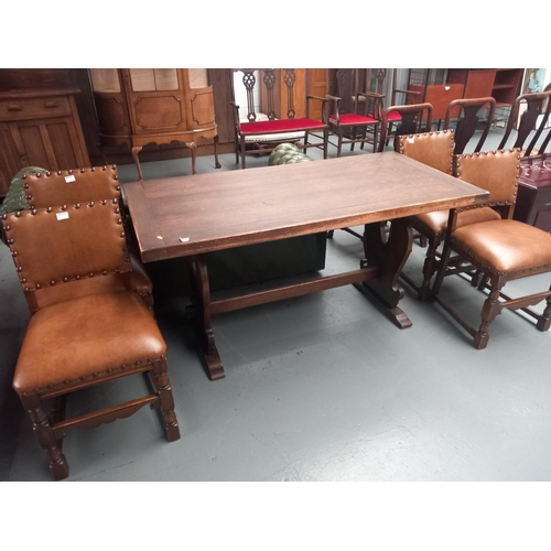 122 - An oak dining table with four chairs