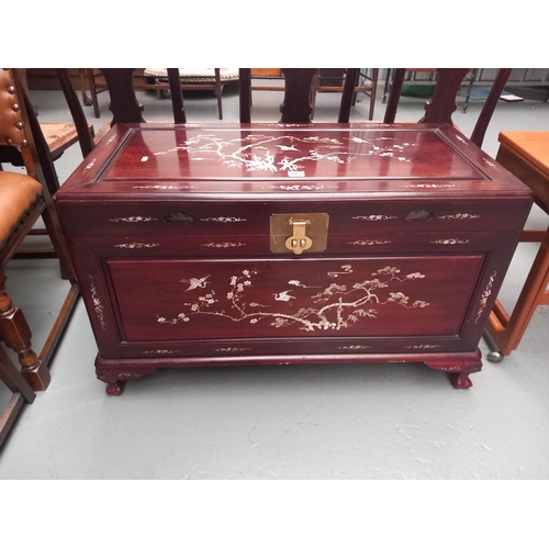 123 - A mahogany mother of pearl inlaid camphor chest