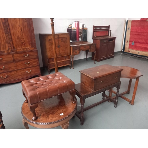 140 - A leather stool, standard lamp, two side tables and an oak telephone cabinet