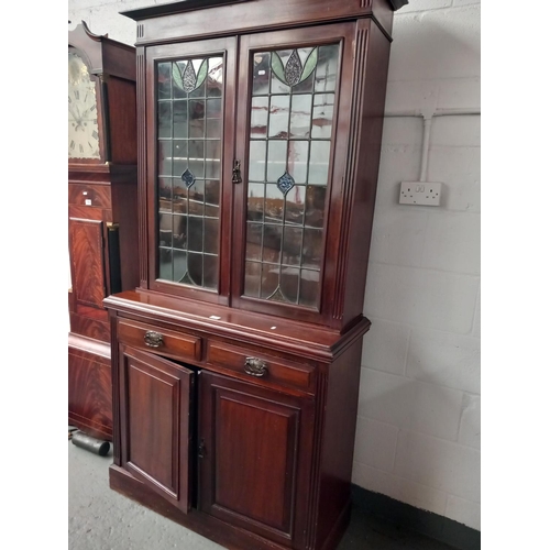 155 - A mahogany chiffonieur with stained glass panels