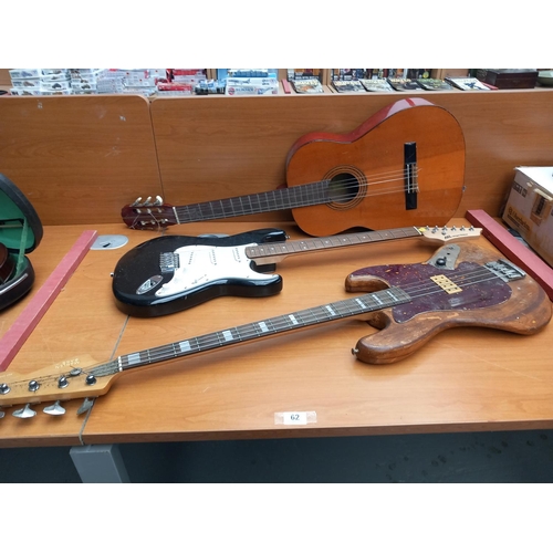 62 - A Saxon acoustic guitar, AXL electric guitar and a vintage marlen bass guitar