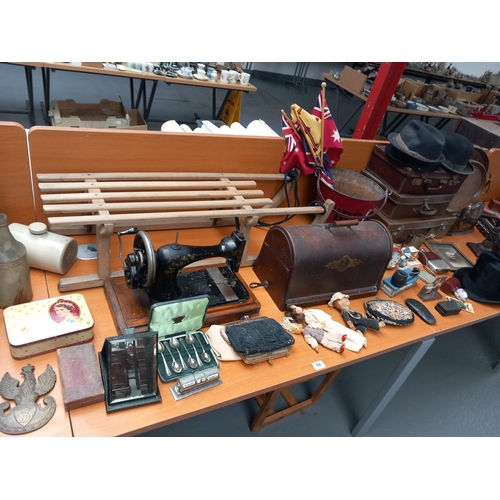 64 - Vintage items to include a fire bucket, leather suitcases, bowler hats, singer sewing machine etc