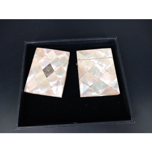 219 - Two mother of pearl card cases - one with silver inscription plate (in perfect condition) and the ot... 