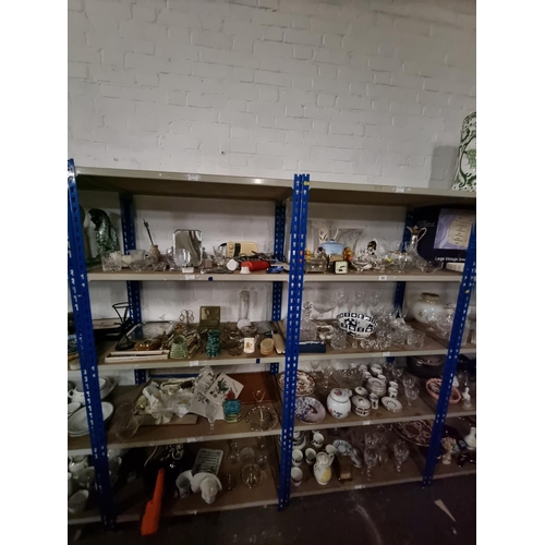 301 - 8 shelves of glass and china to include part tea sets, brassware etc