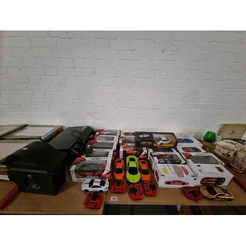 306 - A quantity of remote control cars including Range Rover, Lamborghini, Porsche etc