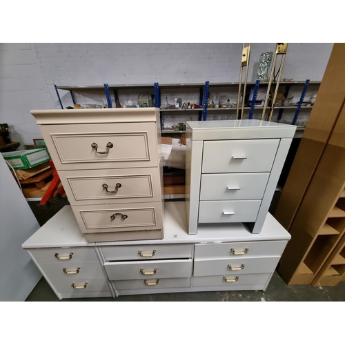 331 - A 6 drawer white dressing table and 3 x 3 drawer bedside cabinets