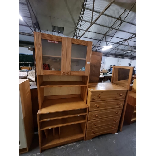 359 - A pine 5 drawer chest of drawers, a pine mirror and a pine wall unit