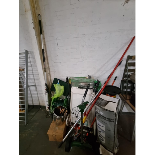 457 - A garden hose, boxed pressure washer, trolleys, etc