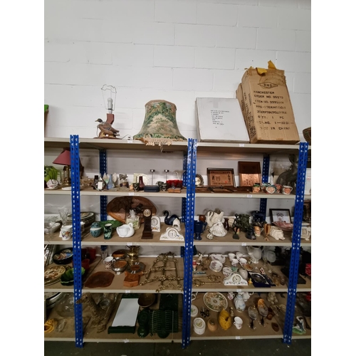 474 - Ten shelves of mixed items including Toby jugs, brass easels, copper pictures, china, etc