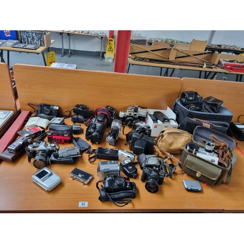 62 - A collection of vintage cameras to include Canon, JVC, Bauer, Olympia, Praktica etc and 2 mobile pho... 