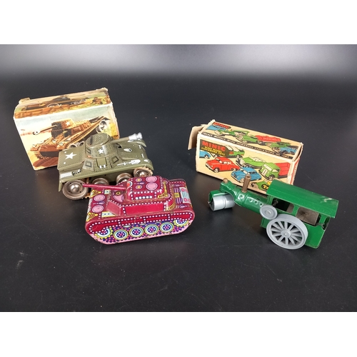 230 - A vintage Gama clockwork tin plate tank with box (damage to the box), a Triang Minic steam roller wi... 