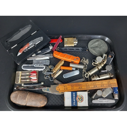 233 - A collection of vintage items - pen knives, cigarette lighters, whistles, a Le Creuset waiters frien... 