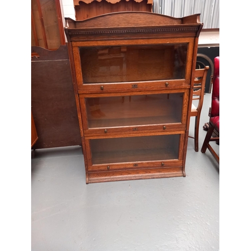 124 - A three section oak Globe Wernicke style bookcase