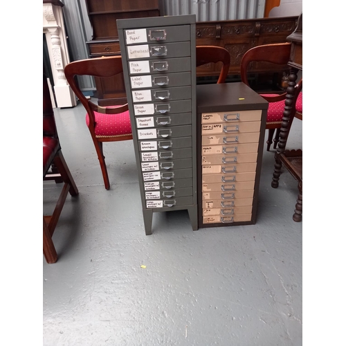 126 - A metal fifteen drawer filing cabinet and a twelve drawer filing cabinet