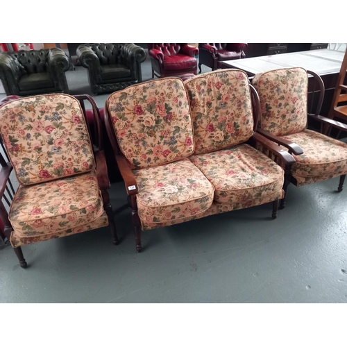 132 - A two seater sofa and two matching armchairs