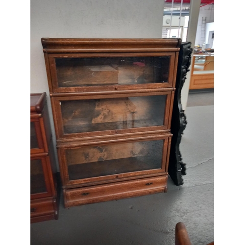 166 - An oak three section globe wernicke style bookcase