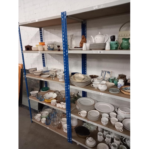 302 - 8 shelves of china including a full tea set, glassware etc