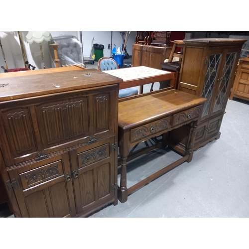 485 - An oak console table, oak display cabinet and an oak drinks cabinet