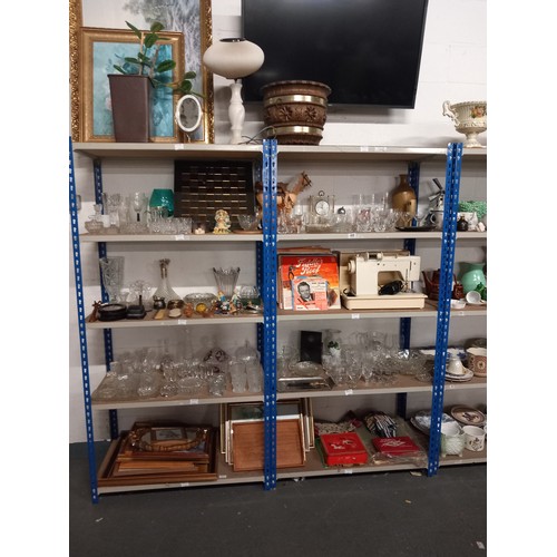 498 - 10 shelves of mixed items to include records, pictures, glassware etc