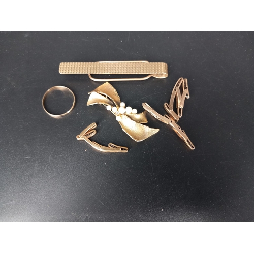 204 - A 9k gold and seed pearl brooch, a 9k gold wedding band, a 9k gold tie pin and a 9k gold watch strap... 