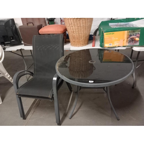 435 - Glass top garden table and two chairs