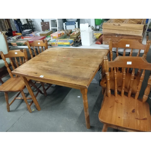 437 - A pine diamond table and four chairs