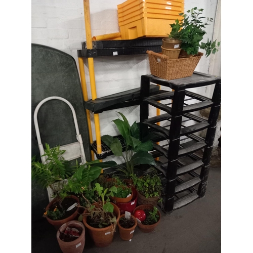 469 - Plastic shelving, plant pots and a plastic garden table