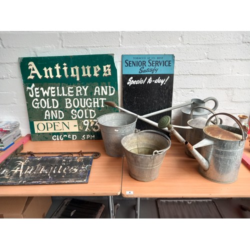 4 - One antique and one tobacco enamelled signs, wooden antique sign, three galvanised watering cans and... 