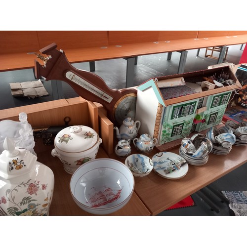 22 - A brass top folding table, chinese tea set, barometer, small dolls house, lamps etc