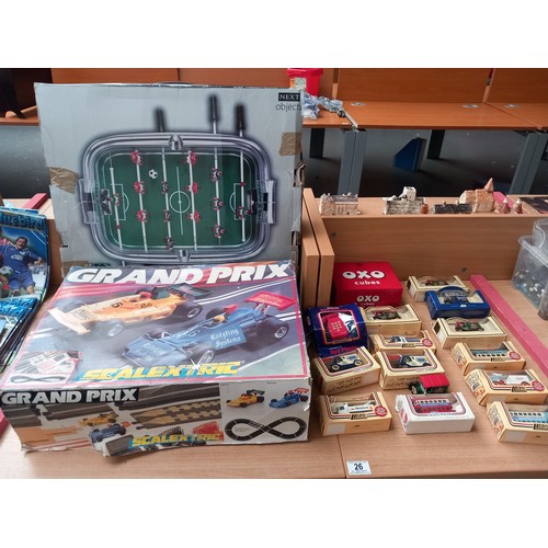 26 - A scaletric grand prix car racing game, table top football game and boxed model cars