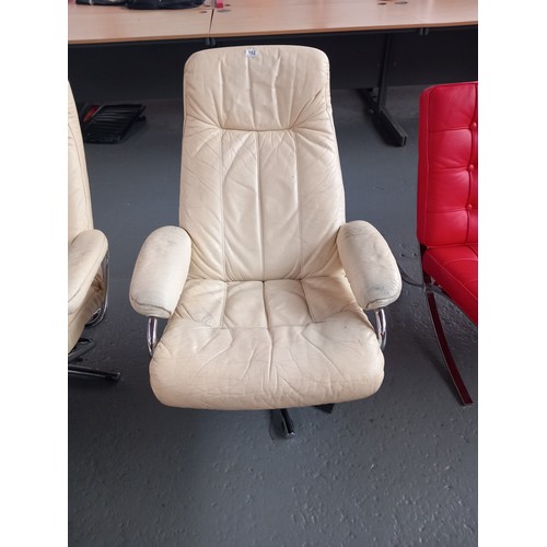 102 - A cream leather Skoghang reclining swivel armchair