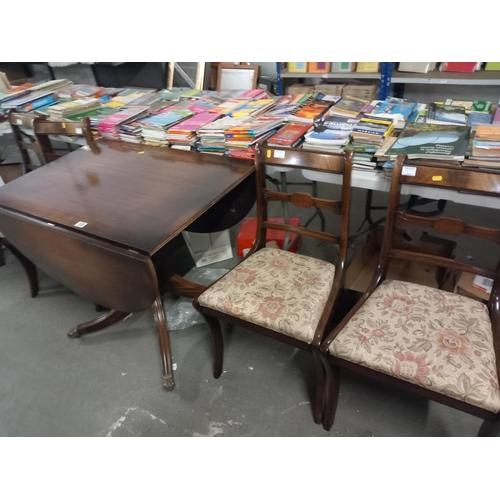 536 - A drop leaf dining table and four chairs