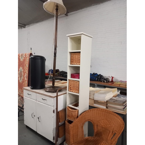 545 - A metal storage cabinet, wicker chair, standard lamp etc
