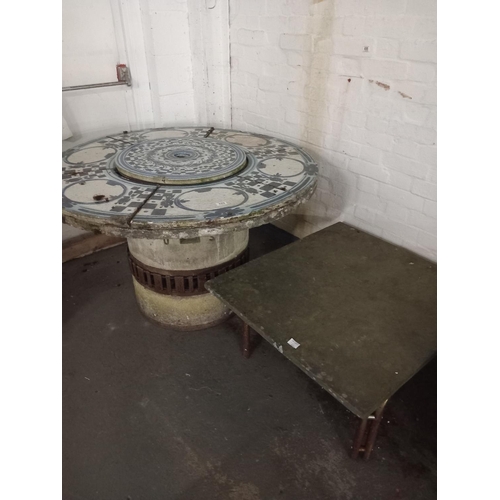 689 - A large tiled top stone fire pit and a slate top table