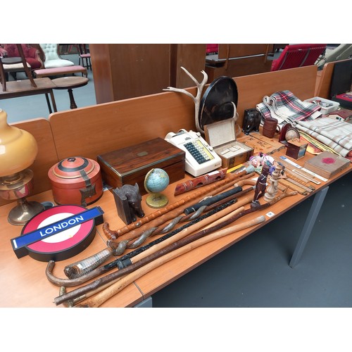 54 - Four woolen blankets, writing slope, oil lamp, walking canes and other wooden items