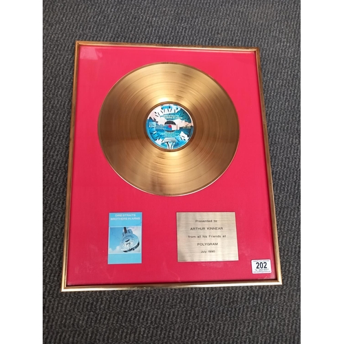 202 - An original framed gold disk Dire Straits 