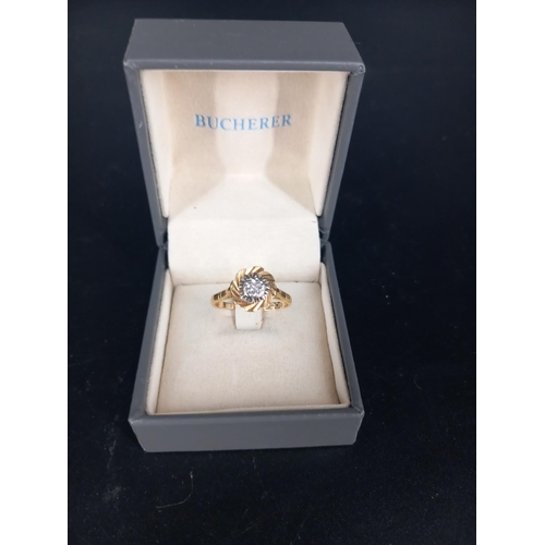 204 - An 18k gold flower shaped ring with small diamond (ring is misshapen) weight 3.2grams