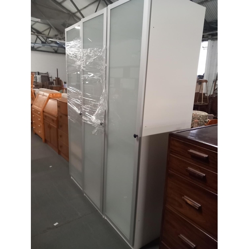 392 - Three large glass fronted cabinets