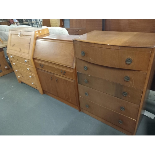 393 - A pine and a teak bureau together with an oak chest of drawers